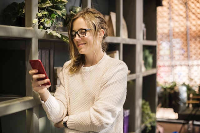 woman holding a mobile phone